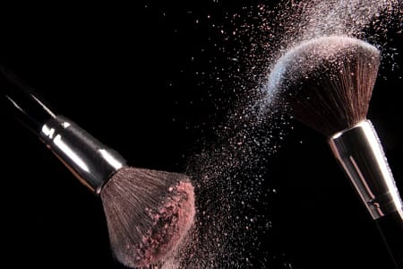 cosmetics makeup brushes and powder dust explosion