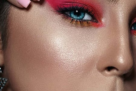 close up photo of woman with pink eyeshadow