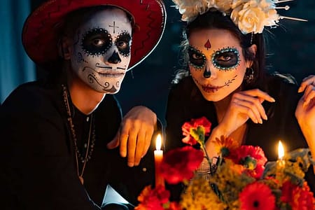 man and woman with scary makeup looking at camera